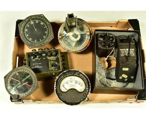 A BOX OF MILITARY ISSUE INSTRUMENTS AND DEVICES, GUAGES ETC, to include U.S Reflector sight, glide path indicator, voltmeter,