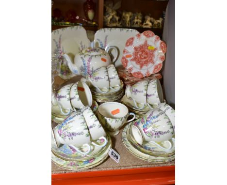 A FOLEY BONE CHINA TEA SET, printed and painted with Hollyhocks (pattern No 2182), comprising a teapot (glued finial and lid 