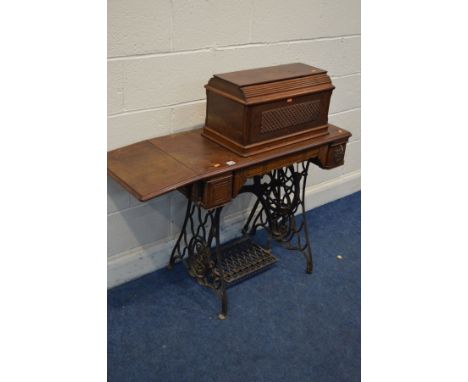 A VINTAGE SINGER TREDLE SEWING MACHINE, with a drop leaf