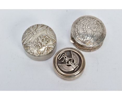 TWO EGYPTIAN SILVER PILL BOXES AND ONE OTHER, the first with an openwork figure of 'Iris' the Egyptian goddess, with Egyptian