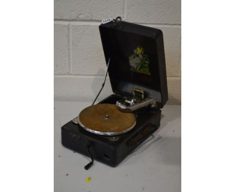 A VINTAGE TIN CASED PORTABLE GRAMAPHONE