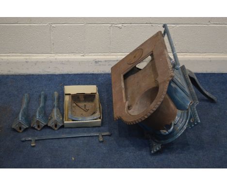 A VINTAGE TEAL ENAMELLED WOOD BURNING STOVE (some cracks to casting, legs loose and other parts)