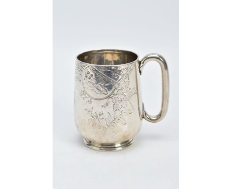 A VICTORIAN SILVER MUG, with a floral and foliate engraved design body, plain polished handle, on a circular base, engraved m