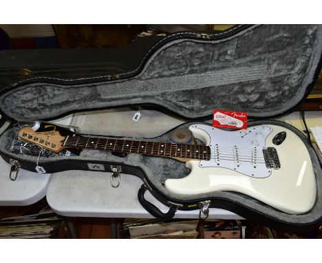 A 2008 MEXICAN FENDER STRATOCASTER Ser No MZ 8019434 in white with white scratch plate, pickup covers and controls, rosewood 