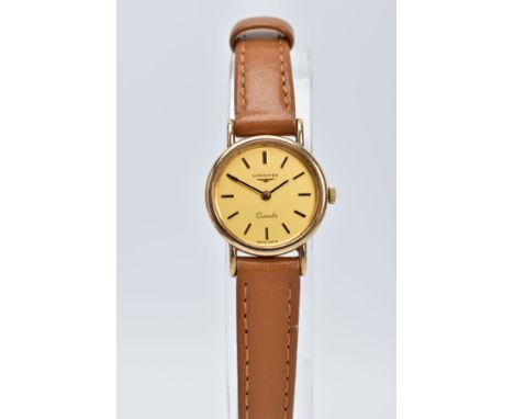 A LADIES 9CT GOLD LONGINES QUARTZ WRISTWATCH, the circular gold tone dial signed 'Longines Quartz', baton markers, black hand