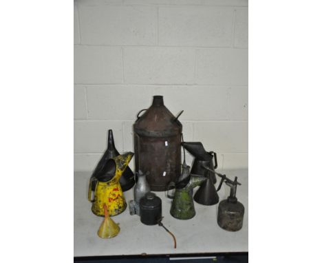 ELEVEN VINTAGE OIL AND LUBRICATION CANISTERS including a Shell and two unbranded oil jugs, two precision oilers, a machine oi