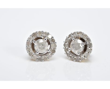 A PAIR OF HALO DIAMOND EARRINGS, each of an openwork circular form, set with a central claw set round brilliant cut diamond, 