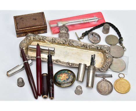 A SELECTION OF ITEMS, to include a silver candle snuffing tray, with an engraved monogram to the centre within a floral embos