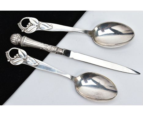 TWO SPOONS AND A SILVER PAPER KNIFE, each spoon with an openwork floral designed handle, stamped to the back B &amp; J 30, to