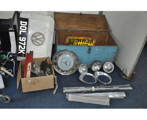 A PLYWOOD CAR BOX AND A BOX CONTAINING VINTAGE CAR PARTS including head and tail lights, brightwork, hub caps, carburetters, 