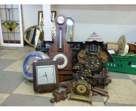 A cuckoo clock, a mahogany aneroid barometer, other clock parts, weights, etc. 