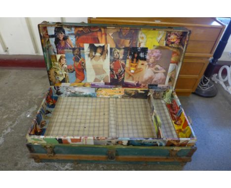 A vintage banded green steamer trunk 