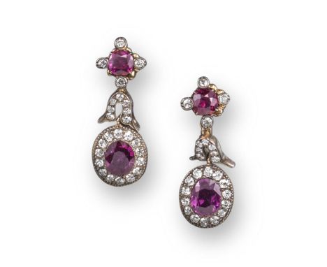 A pair of late 19th century ruby and diamond cluster earrings, the upper quatrefoil of ruby and diamonds suspending an articu