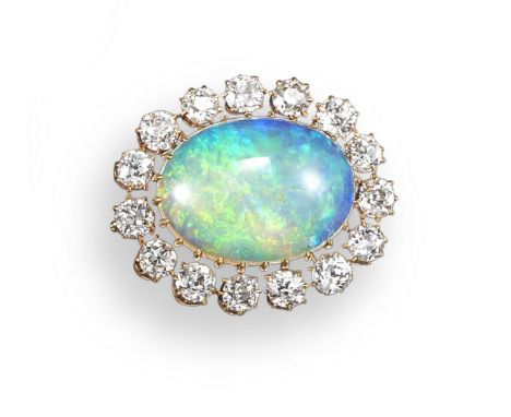 An opal and diamond cluster brooch, the oval-shaped opal set within a surround of fifteen old circular-cut diamonds in yellow