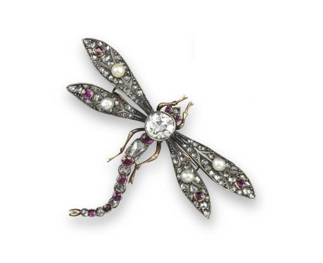 A Victorian ruby and diamond dragonfly brooch, set with a central diamond weighing approximately 1.90cts, the thorax set with