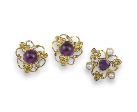 A pair of 18ct gold amethyst cabochon earrings by Valerie Pickford, set within yellow gold pellet and scroll decorated surrou