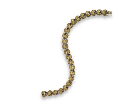 A sapphire and diamond bracelet, designed as textured scallop-shaped links, each set with a circular-cut sapphire in yellow g