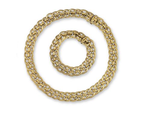 A fancy-link gold necklace by Garrard, designed as interlocking oval-shaped links with pellet decoration, 43cm long, with a m