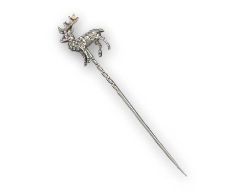 A late Victorian stag stickpin, pave-set with rose-cut diamonds and a ruby eye, in silver and gold, 1.5cm wide