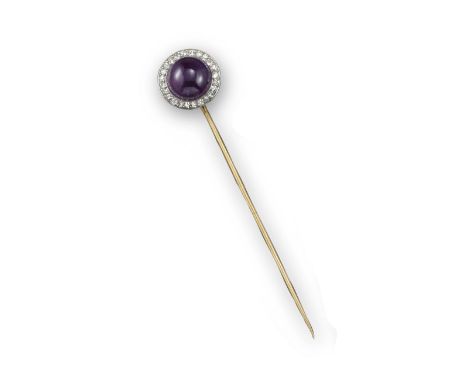 An amethyst and diamond stick pin by Cartier, set with a circular amethyst cabochon within millegrain-set diamond border in p