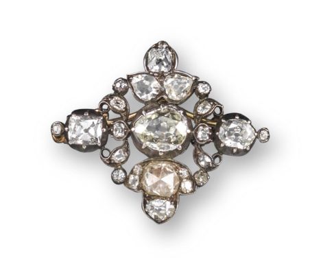 A quatrefoil early 19th century diamond brooch pendant, set with a central old pear-shaped diamond which weighs approximately