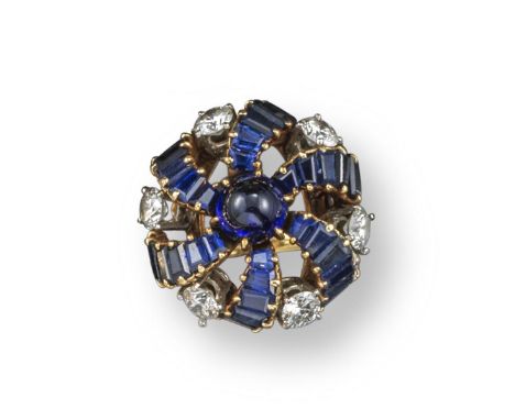 A sapphire and diamond cluster ring, c.1950, the six curved branches set with tapered baguette and rhomboid-shaped sapphires 