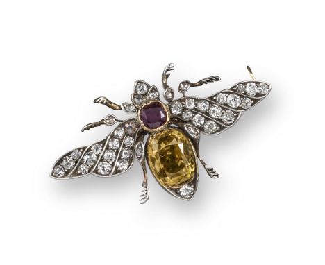 A Victorian zircon and diamond bee brooch, the body formed from a cushion-shaped yellow zircon and a cushion-shaped ruby, wit