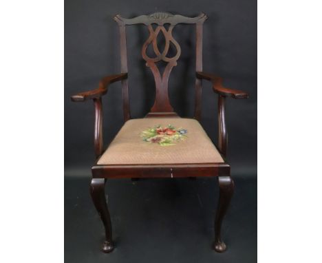 A 'Chippendale Revival' mahogany open arm elbow chair, with pierced splat, drop in seat, on cabriole legs.