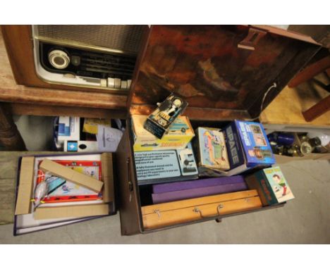 A collection of games and toys in a tin trunk