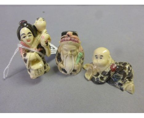 Three netsuke style carvings to include baby, lady with baby and old man