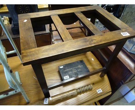 A vintage walnut luggage rack