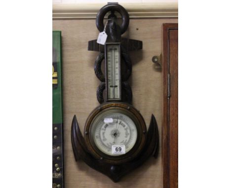 Wooden barometer with nautical theme