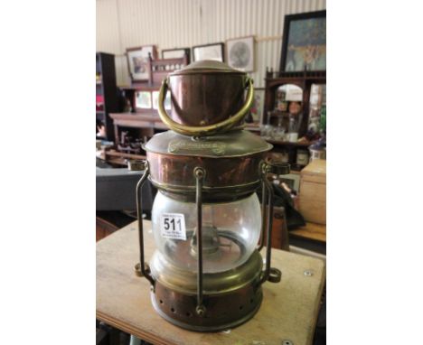 A brass vintage ship's lantern marker "Anchor"