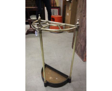 A brass and cast iron stick stand 