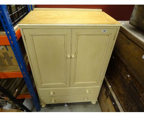 A vintage painted and distressed linen cupboard with two drawers