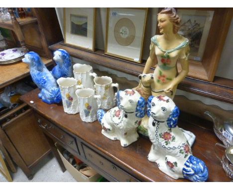 Two pairs of the Staffordshire dogs, along four ceramic jugs