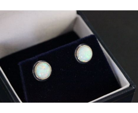 A pair of silver and opal stud earrings 