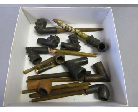 Box of vintage tribal pipes etc including a gold rimmed cheroot holder
