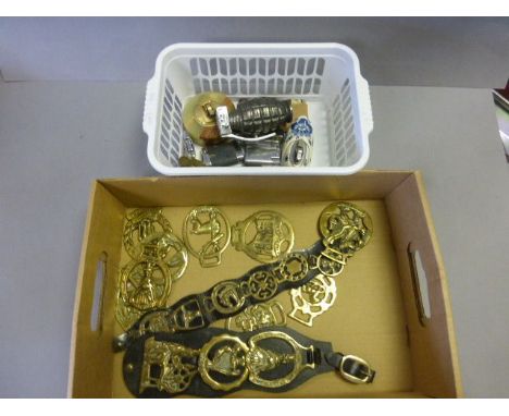 Box of vintage horse brasses and lighters
