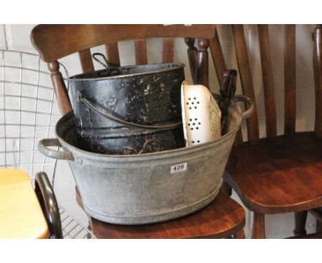 A collection of vintage metal kitchen ware to include tin bath