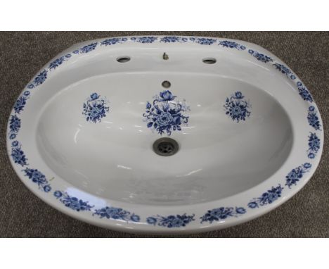 White pedestal wash basin with Victorian style blue printed decoration, the bowl with scalloped underside