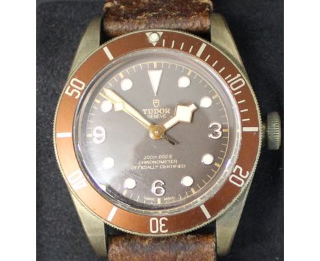 Gents Tudor Bay Heritage chronometer wristwatch with bronze and brown dial, leather strap, serial number I801227, model 79250
