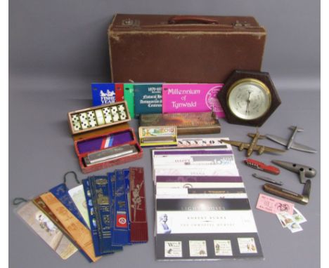 Small suitcase containing bookmarks, Hohner Super Chromonica, Hohner Echo Super Vamper harmonica, dominoes, cribbage board, b