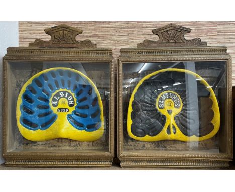 2 replica vintage tractor seats in display cases