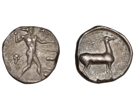 Greek Coinages, Bruttium, Kaulonia, Nomos, 475-425, Apollo walking right, bucranium within wreath to left, stag on pediment t