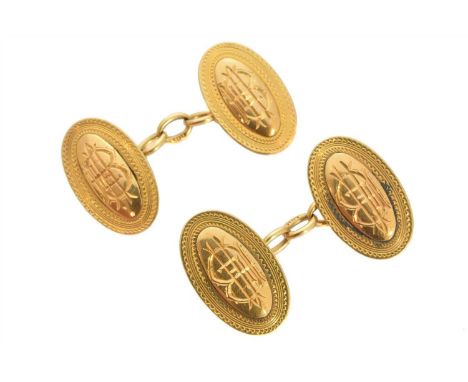 A pair of 1920s 18ct gold cufflinks, each designed as a pair of oval shape panels with central monogram and scrolling surroun