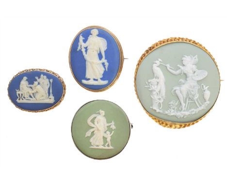 Three Wedgwood brooches, each designed as an oval or circular ceramic jasperware panel depicting classical scenes, together w