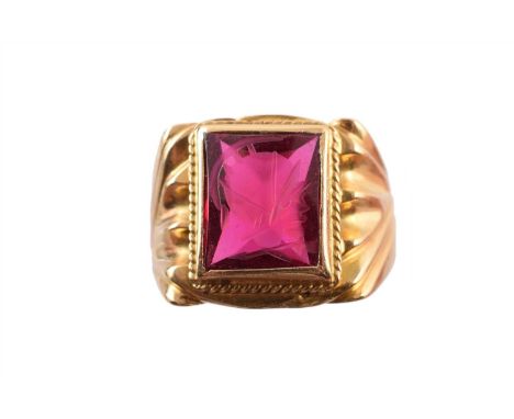 A synthetic ruby intaglio ring, the rectangular synthetic ruby intaglio with tapered shoulders, ring size U, gross weight 11.