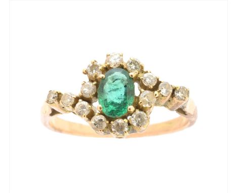 An emerald doublet and diamond dress ring, the oval emerald doublet within a brilliant cut diamond surround, estimated total 