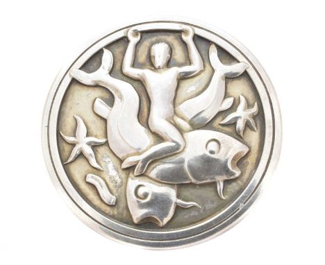 A silver Georg Jensen brooch, no. 285, designed by Arno Malinowski for Georg Jensen, depicting a merman and fish within a cir